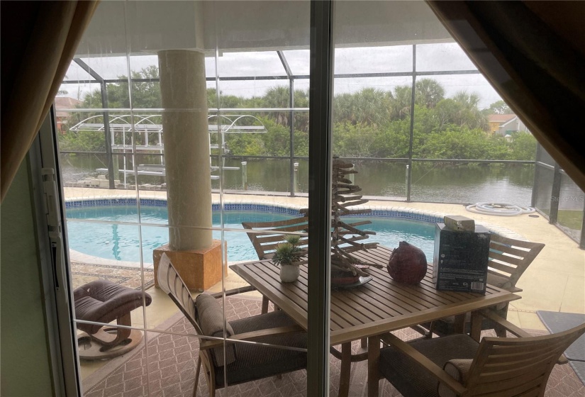 PRIMARY BEDROOM VIEW TO POOL LANAI