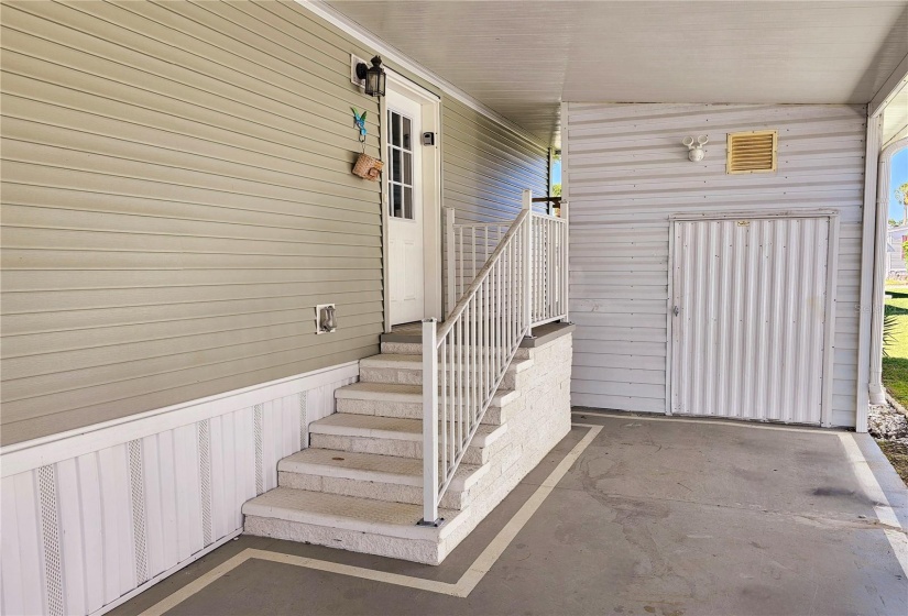 Side entry with solid staircase, Utility room with electric and lots of shelving and work bench