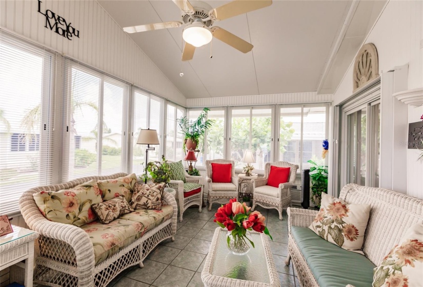 Enjoy friends and family over for fun chats on this large air conditioned lanai with new windows.