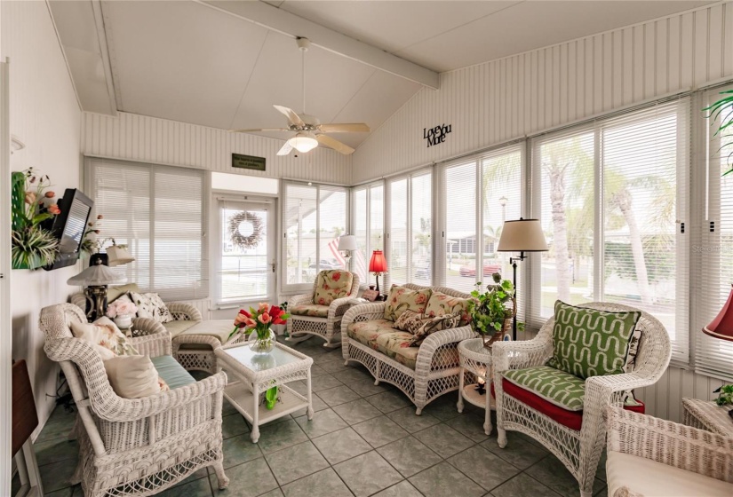 Enjoy friends and family over for fun chats on this large air conditioned lanai with new windows.