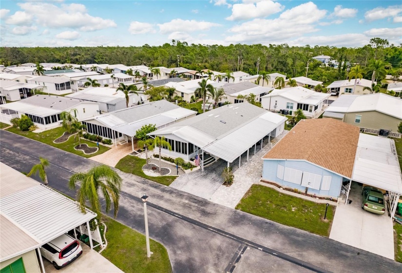 Aerial view of home and part of the park. Love those amazing trees throughout the community.