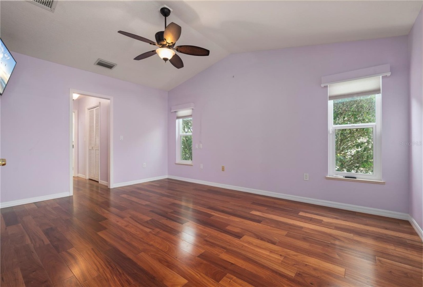 Primary Bedroom with wood floors