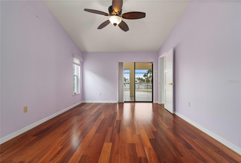 Primary Bedroom, vertical cellular shade covers sliding glass door