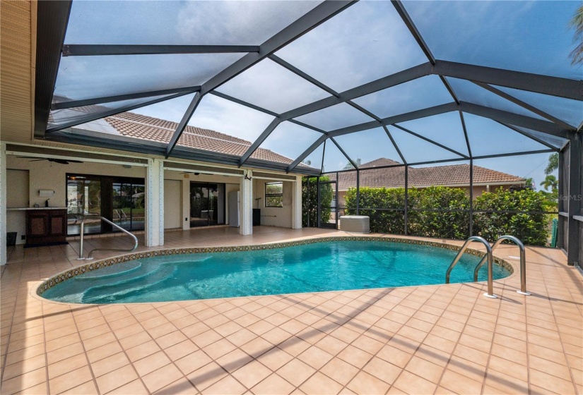 tiled floor around pool and lanai