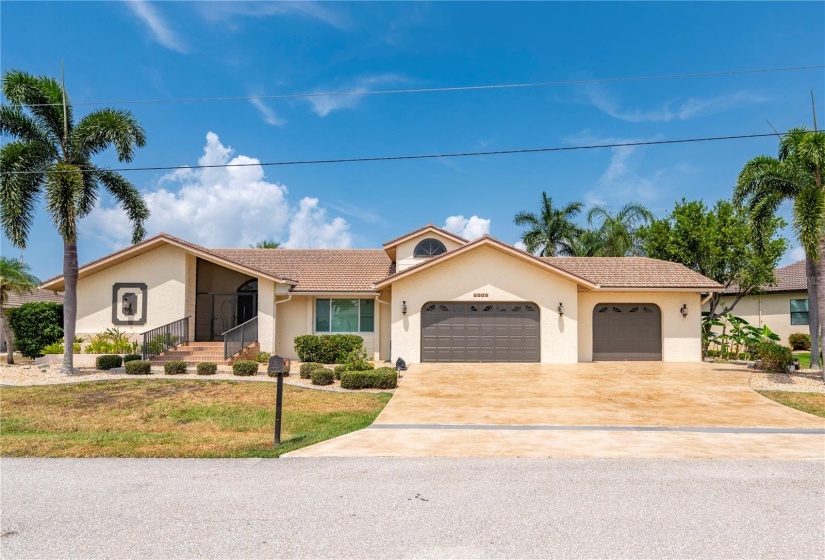 WIDE driveway and TRUE 3 car garage