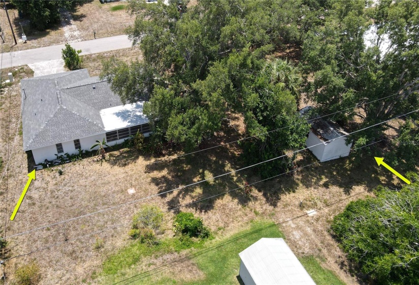 Aerial view of home and adjacent lot