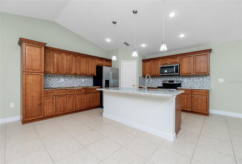 Kitchen with lots of counter and storage area.