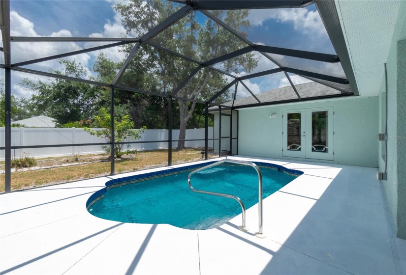 Pool view with entrance to primary bedroom