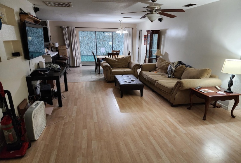 Living room with triple sliding glass doors closed