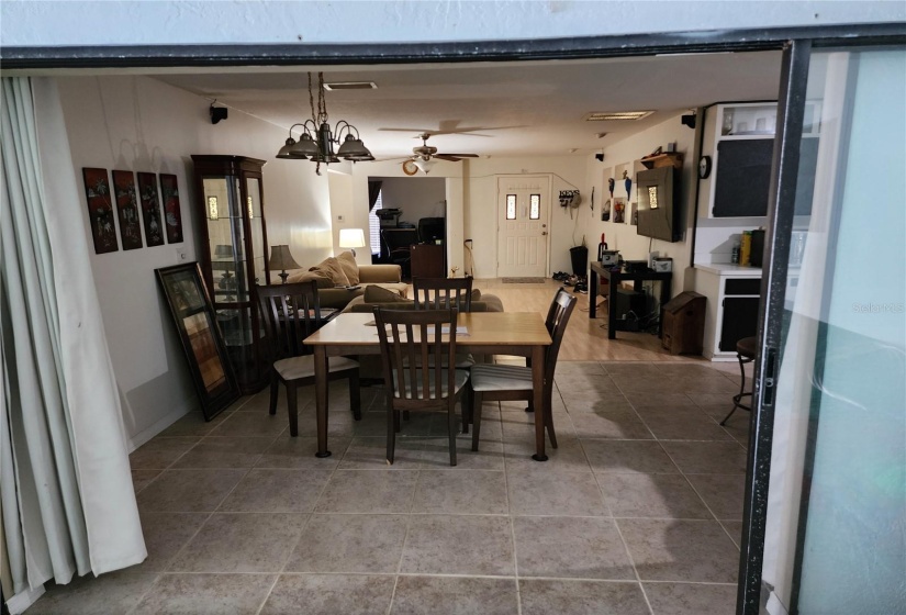 Dining room and living room view from indoor pool area