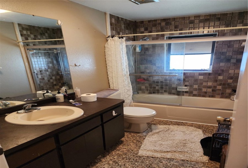 Second bathroom with bathtub/shower combination