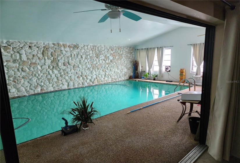 Indoor pool - view from inside home thru triple sliding glass doors