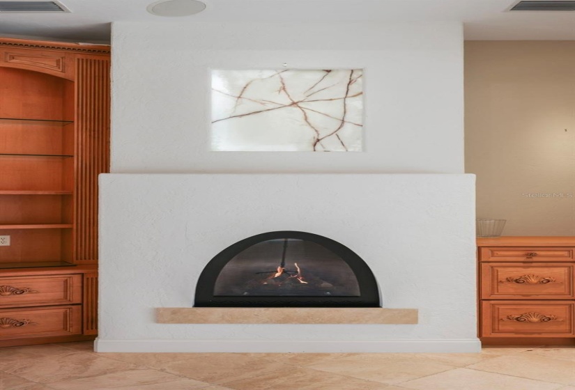 Gas fireplace with back-lit white onyx