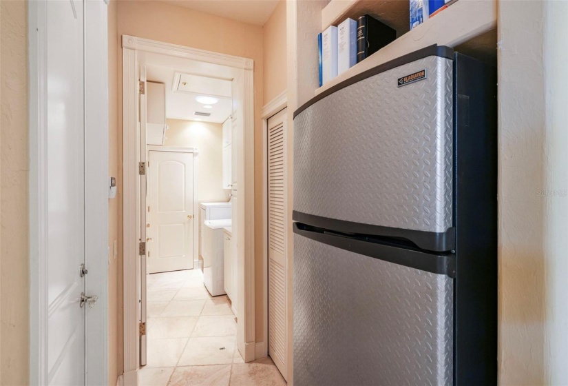 Extra refrigerator out of sight of guests