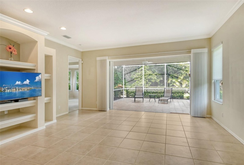 Built-in shelving,large sliders to Lanai, Master Bedroom at back left.