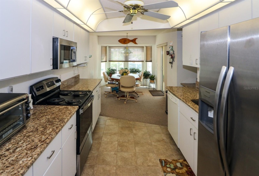 awesome galley kitchen with plenty of cabinets