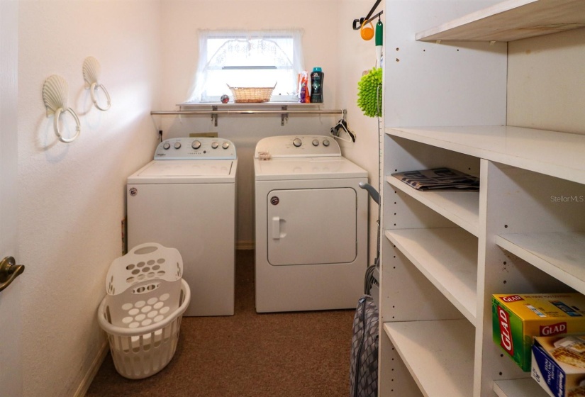 laundry room with storage