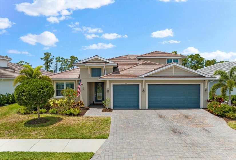 Three car garage & brick paver driveway