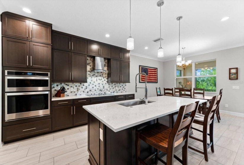 Solid 42 inch wood cabinets with custom built-ins and quartz countertops