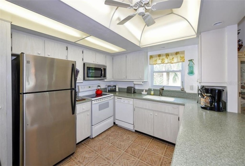 SPACIOUS KITCHEN WITH CORIAN COUNTERS