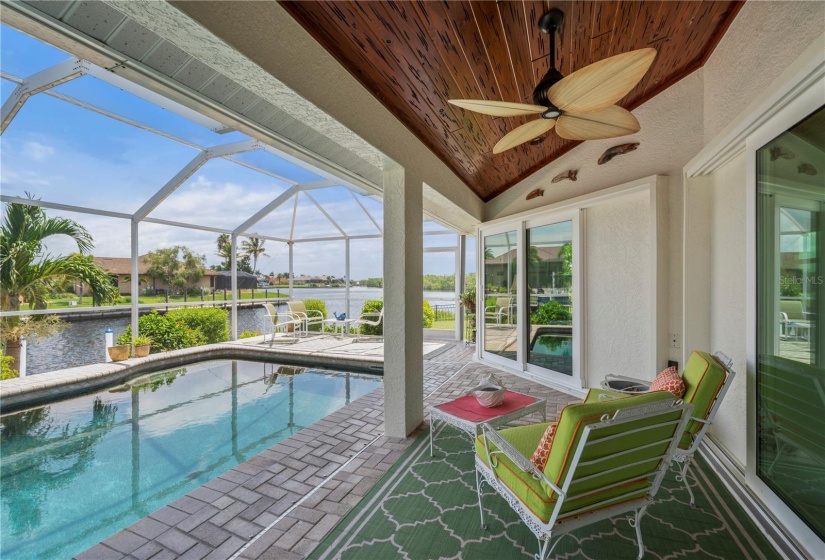 Under truss lanai area. Pecky cypress wood ceiling.