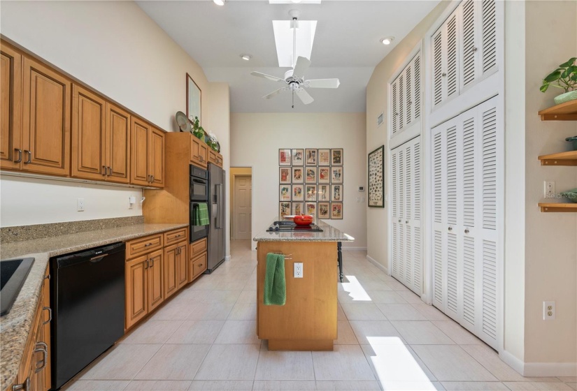 Wood cabinet doors, Double height pantry closets, engineered quartz countertops