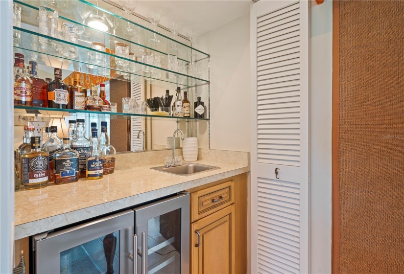 Wet bar with combo fridge/wine cooler, double bi-fold doors to conceal bar when not in use