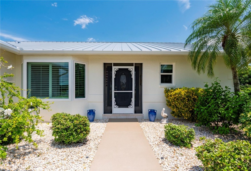 Screened entry door and PGT Impact casement windows for cross breezes in cooler months