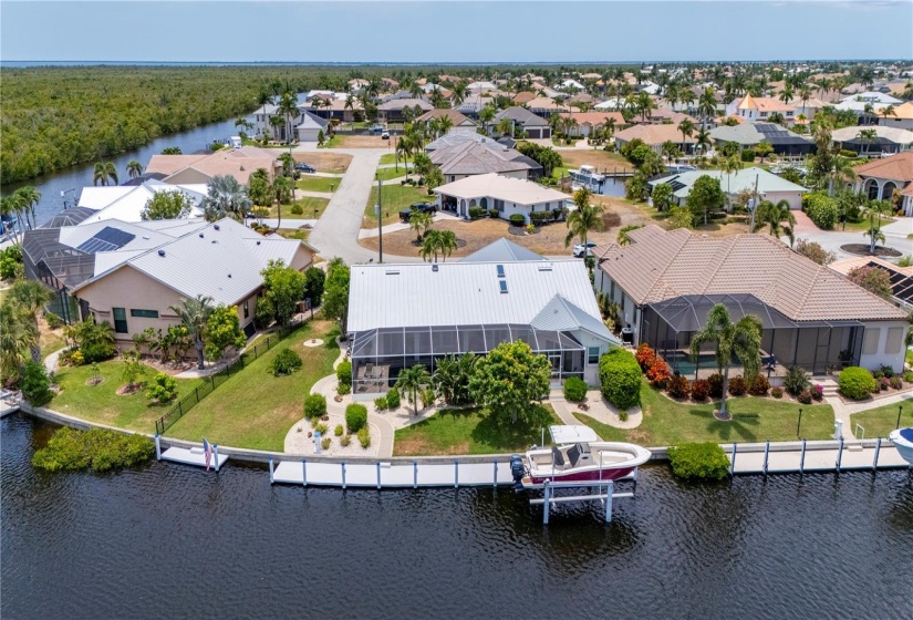 Aerial looking west at rear of home