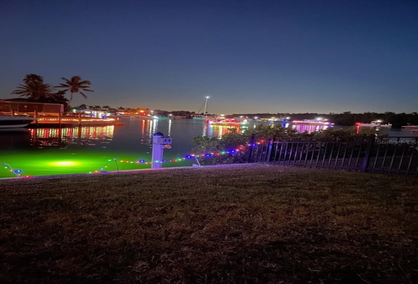 Christmas Boat Parade, Boats come from far side of Sunset Lake and past the house before proceeding down the rim canal.