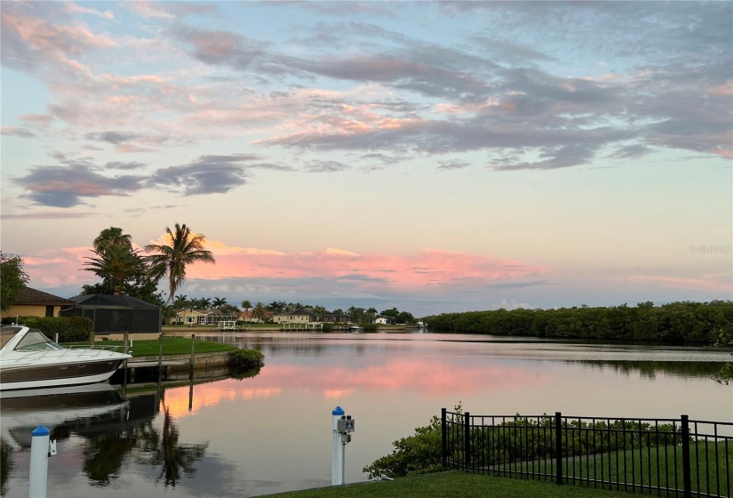 An evening sunset reflected in the eastern sky and onto Sunset Lake