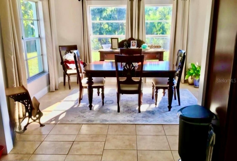 Picture Perfect Formal Dining Room with Great View of the Tropical Landscape Leading to a Freshwater Canal Kayaking Anyone?