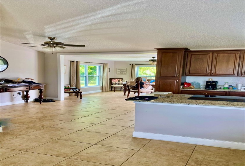 Dining Area By the Kitchen with Lighted Ceiling Fan, Neutral Ceramic Tile