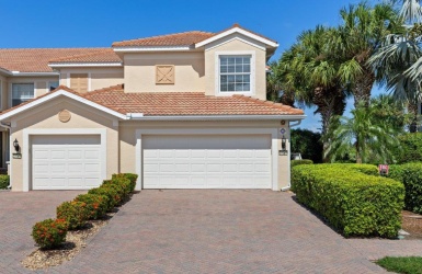 Front elevation showing the 2 car garage and paver driveway.