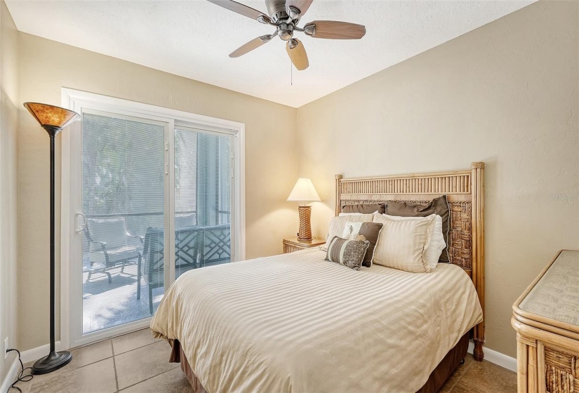 Master bedroom with sliders to screened in porch