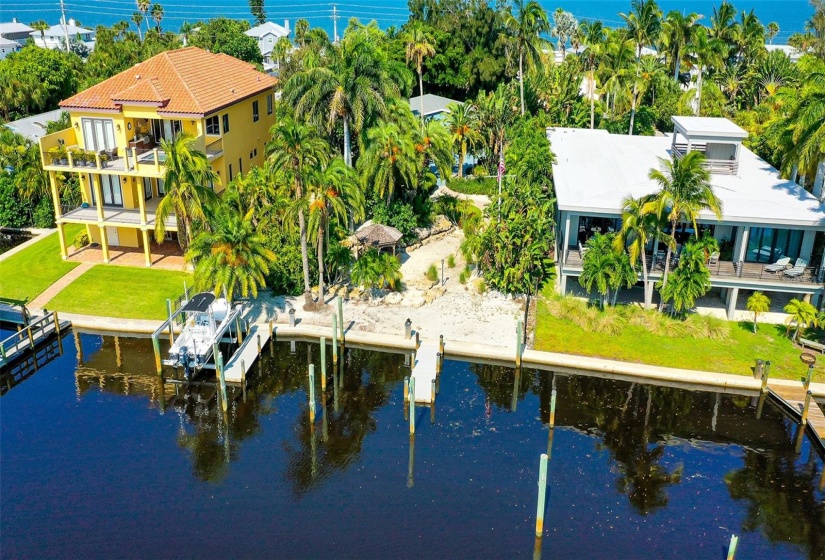 Aerial looking from Intracoastal.  House in background.  Property has 4 boat slips.