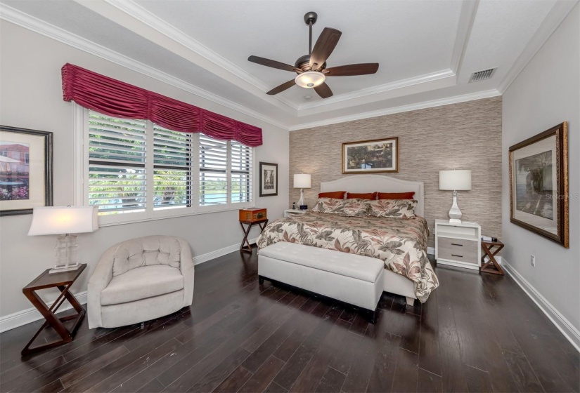 Primary Suite with lanai entrance lakeview, coffered ceiling...