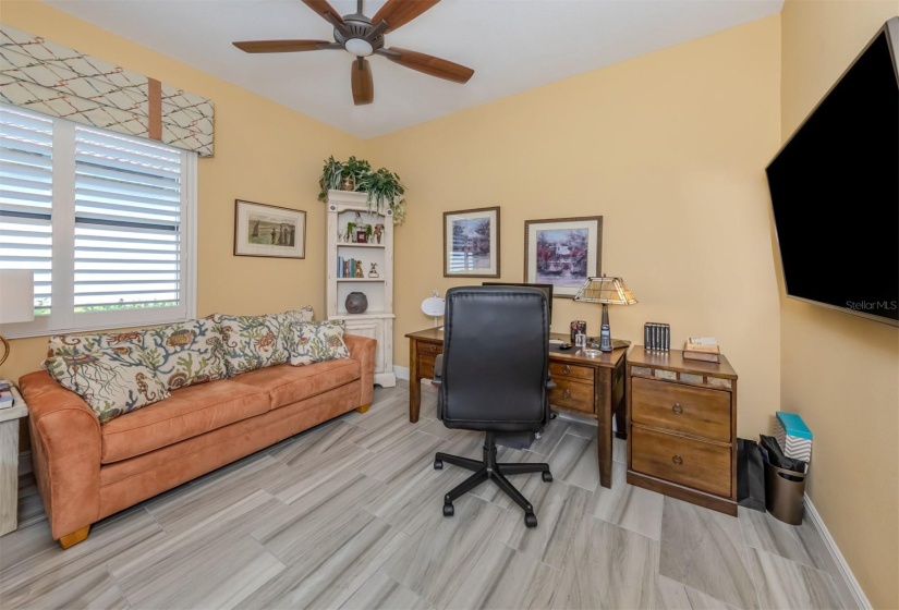 Third bedroom used as office with sleeper sofa.