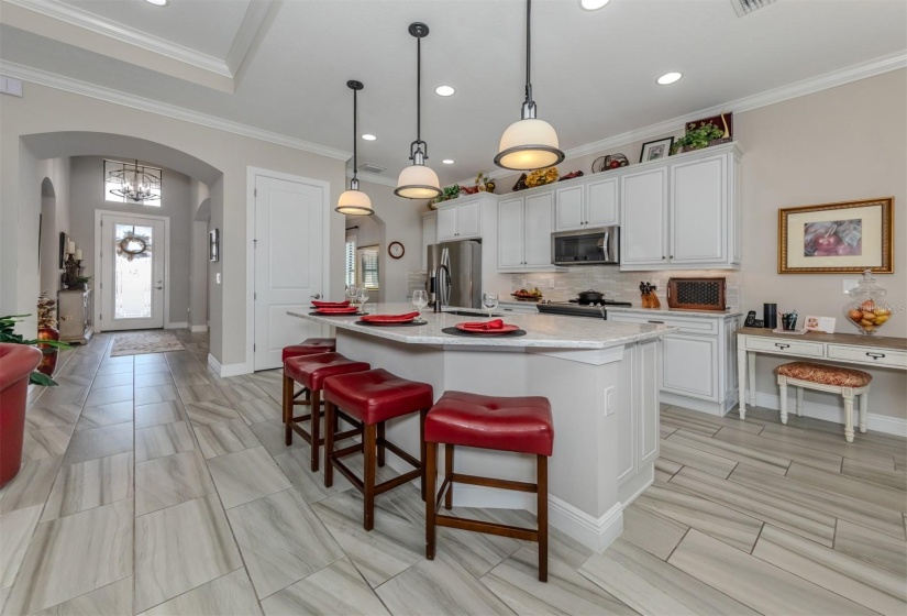 Lots of storage beautiful backsplash, cabinet lighting