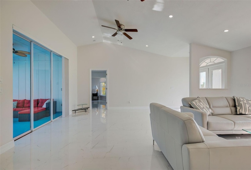 Living room opens all the way up to the lanai and pool area.