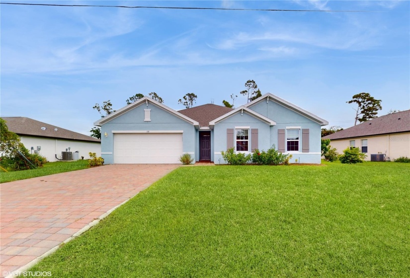 VIEW OF THE FRONT OF THE HOUSE, LARGE PAVER BRICK DRIVEWAY.