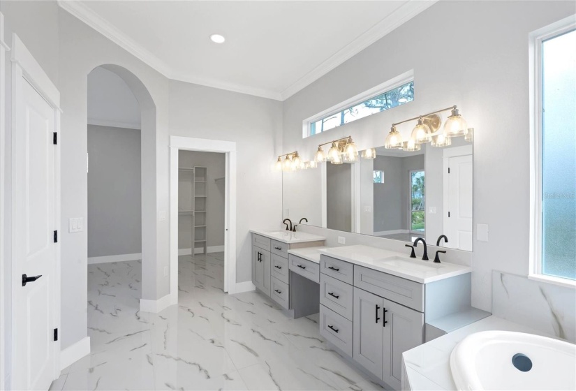 Master Bath has a separate commode area & linen closet