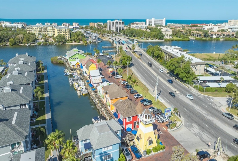 The neighboring waterside shops, restaurants, and boat club, looking west toward Siesta Key.