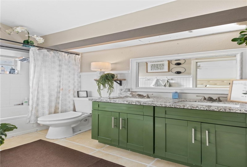 PRIMARY BATHROOM DUAL SINKS GRANITE AND TILE.  LIGHT AND BRIGHT