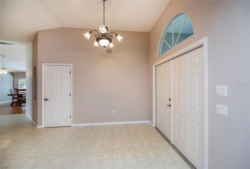 grand double door front entry with sunburst window