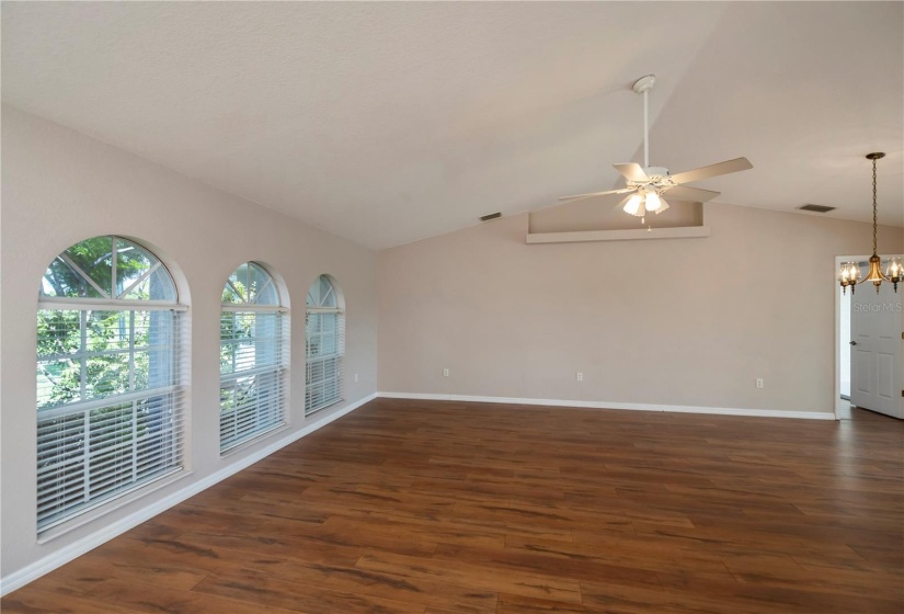 trio of sunburst windows in front living room