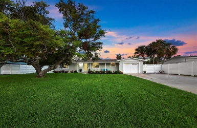 The property has a tremendous yard with lush vegetation.