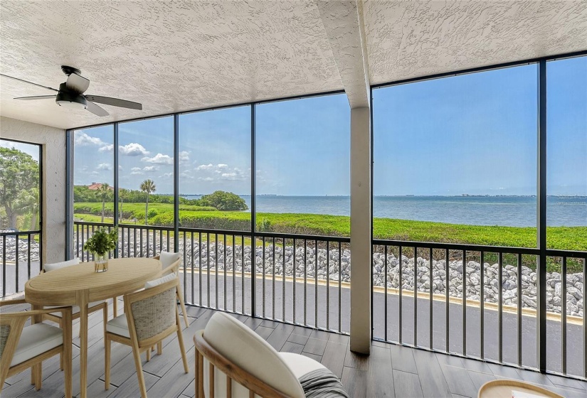 Virtually staged - spacious screened terrace right on the bay