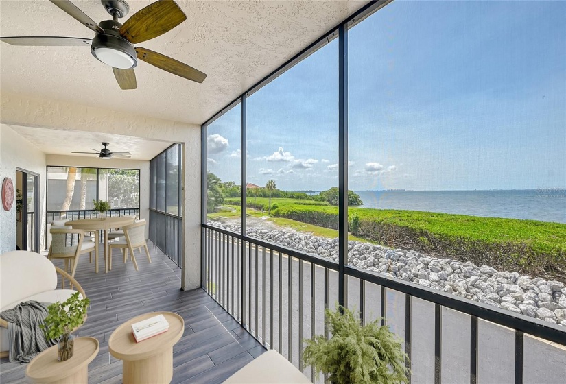 Virtually staged - spacious screened terrace right on the bay