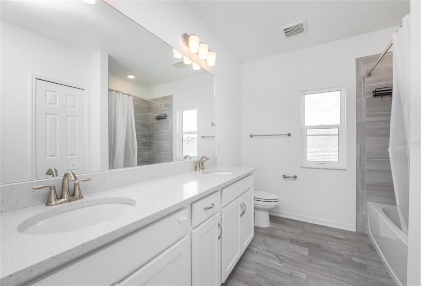 Bathroom upstairs with tub.